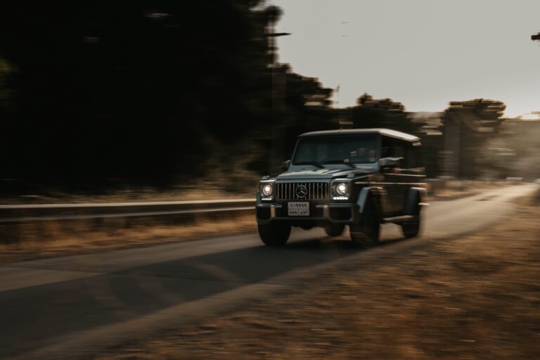 Mercedes G-class captured in a desert on a highway in motion